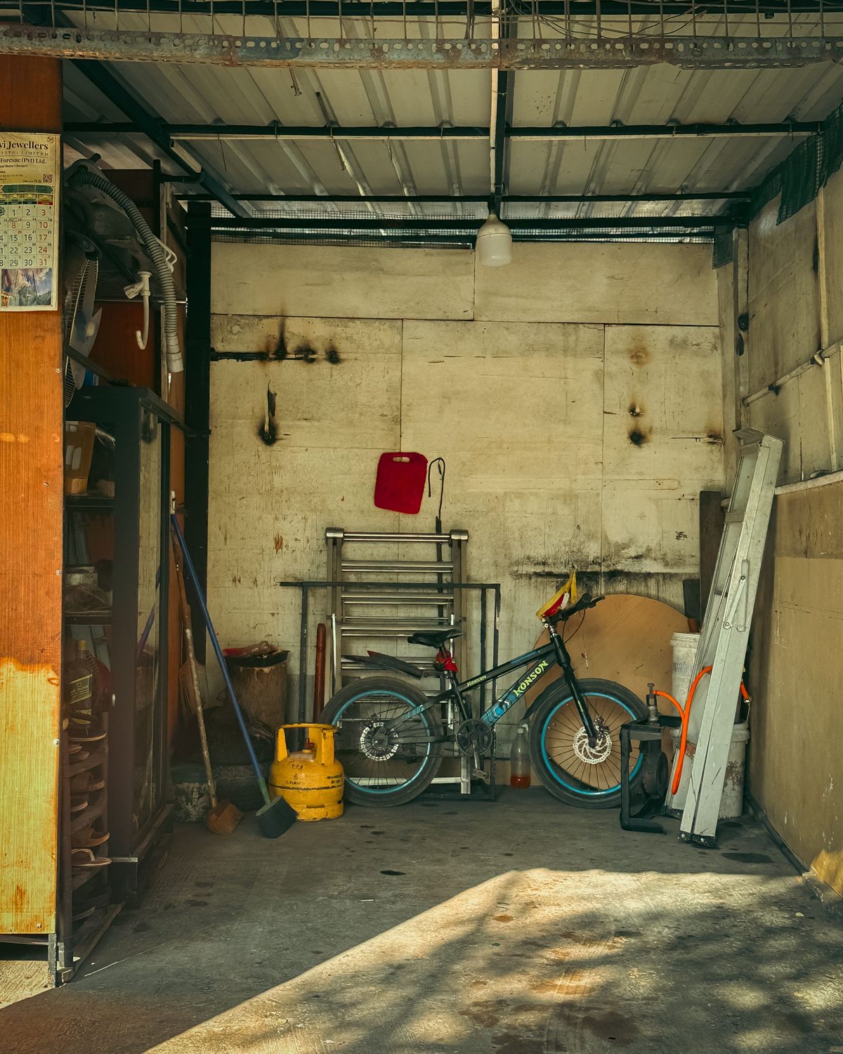 Garage tools and storage bins organized with QR code labels